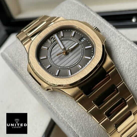 Patek Philippe Nautilus 7011/1R Patek Philippe 7011-1r-010 Black Dial Gold Bracelet Replica on the stand