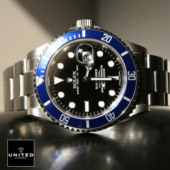 Rolex Submariner Date 16610 Rolex Submariner Date 16610 Black Dial Oyster Replica on the table