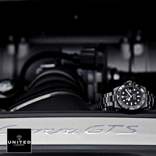 Rolex GMT-Master II 116710 Rolex Blaken GMT-Master II 116710 Black Oyster Replica on the black table