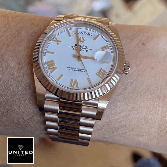 Rolex Day-Date 118235F-0024 President Rose Gold Roman Dial Ultra Fine Replica rolex day date 118235f 0024 replica romannumerals Rolex Day-Date President 118235f-0024 Rose Gold Fluted Bezel Replica on his arm