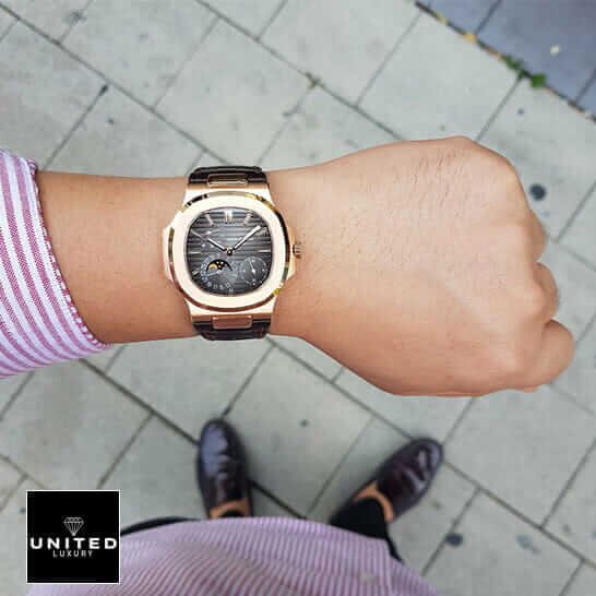 Patek Philippe Rose Gold Case Black Dial Leather Bracelet Replica on the man wrist