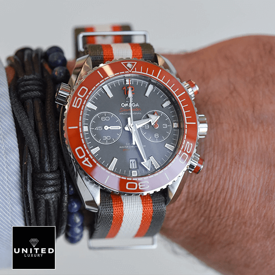 Omega Seamaster Planet Ocean 215.32.46.51.99.001 Omega Seamaster Planet Ocean Grey Dial Replica next to bracelet
