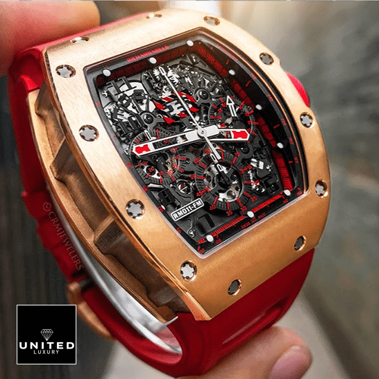 Richard Mille RM 011 Richard Mille Black Dial Gold Bezel Replica on the fingers