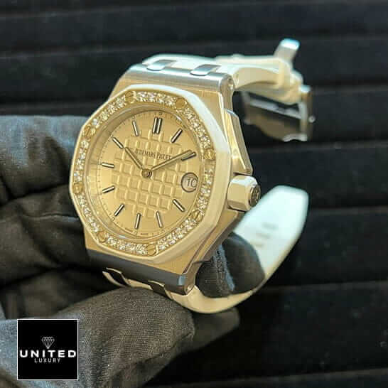 Audemars Piguet Royal Oak 67540SK.ZZ.A010CA.01 AP Royal Oak Diamond Bezel White Dial Replica on the hand & black background